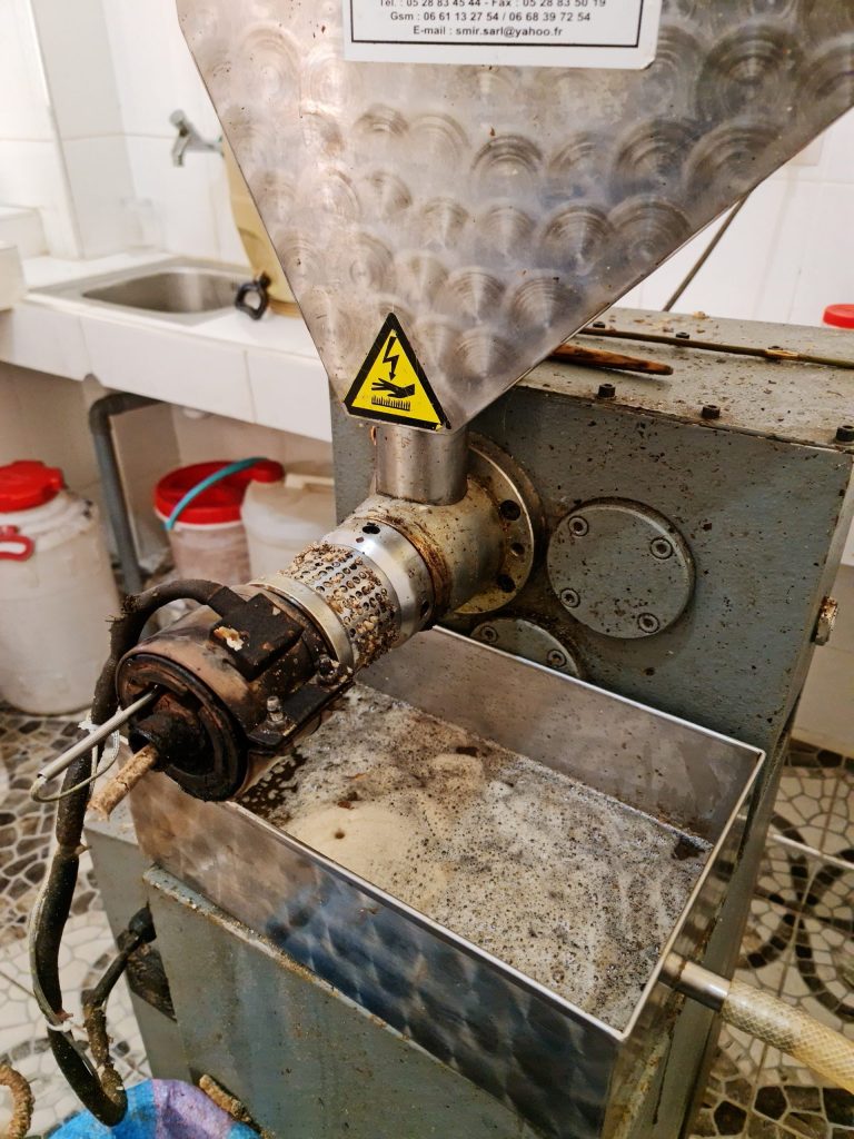 Industrial machine that grinds nuts and extracts oil