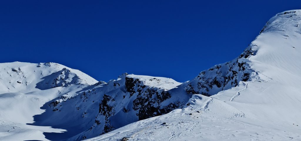 Our tracks to the high point on our previous attempt. The south-westerly ridge leading to the summit of Pischahorn