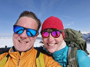 Quick selfie at the Dreibündenstein before snowshoeing to Feldis - the wind creating a new straight-back hairstyle for me...