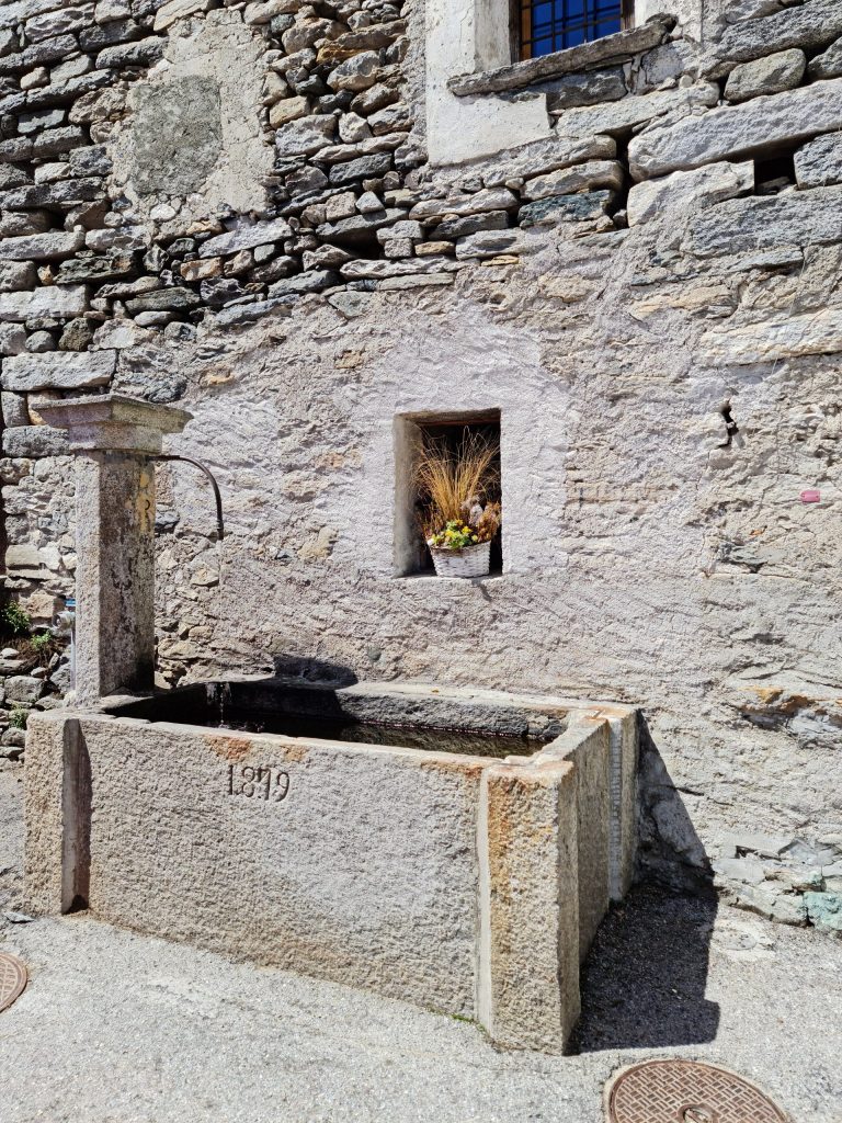 Stone fountain in Corippo dated 1879, though the town was first mentioned in 1224
