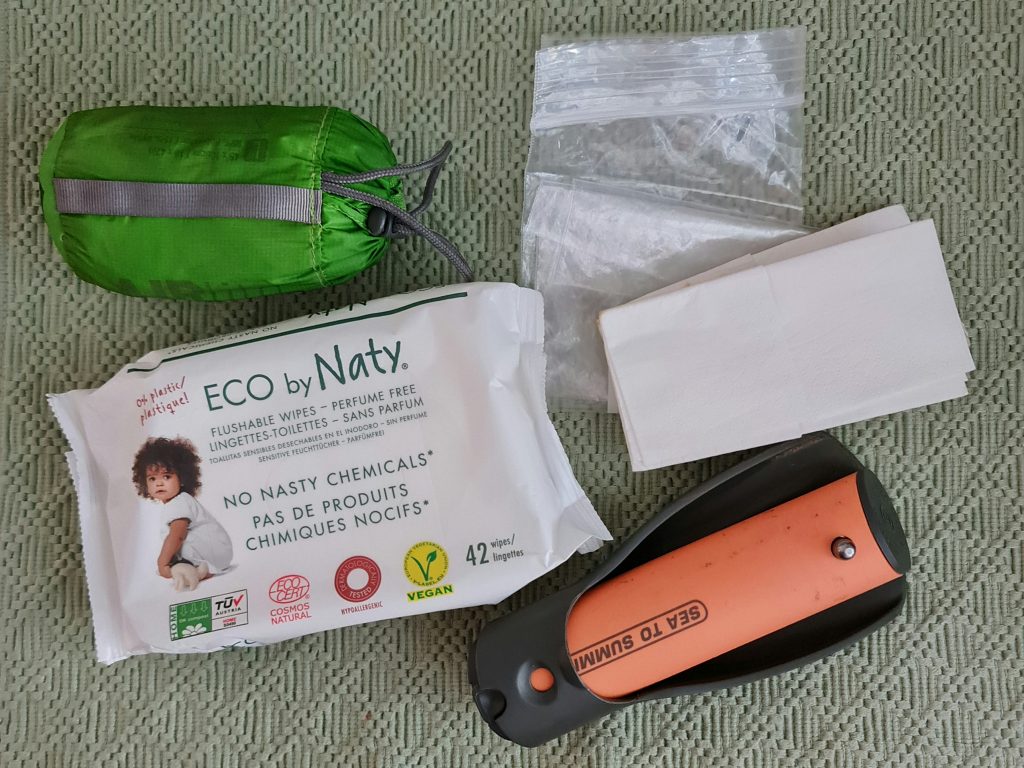Toilet kit: eco-friendly flushable wipes, paper, zip lock bag, trowel, and small hand-towel